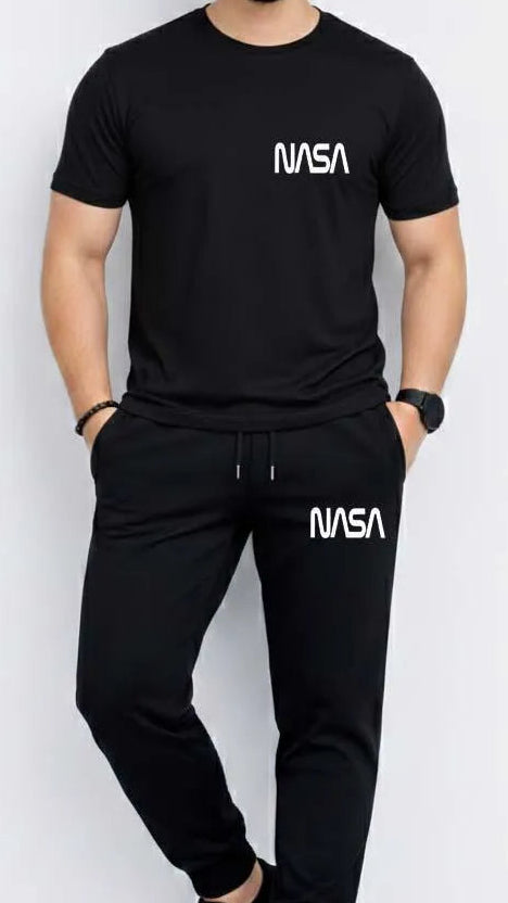 Person wearing a black NASA t-shirt and pants on a white background